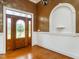 Elegant foyer featuring hardwood floors and a decorative glass front door at 2819 Russell Mcpherson Rd, Burlington, NC 27215