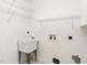 Laundry room area with utility sink and shelving at 2819 Russell Mcpherson Rd, Burlington, NC 27215