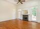Bright living room featuring a cozy fireplace and ample natural light from the French doors at 2819 Russell Mcpherson Rd, Burlington, NC 27215