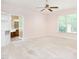 Carpeted main bedroom with ceiling fan and ensuite bathroom at 2819 Russell Mcpherson Rd, Burlington, NC 27215