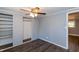 This bedroom has wood look floors, a ceiling fan, and gray painted walls at 3013 Avery St, Raleigh, NC 27610