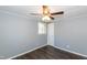 This bedroom has wood look floors, a window and neutral paint at 3013 Avery St, Raleigh, NC 27610