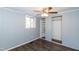 Cozy bedroom with natural light, built-in shelves, and wood-look flooring at 3013 Avery St, Raleigh, NC 27610