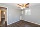 Bedroom featuring wood-look flooring, a window, and neutral paint, perfect for relaxation at 3013 Avery St, Raleigh, NC 27610