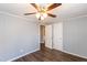 Bedroom featuring wood-look flooring, ceiling fan, and neutral paint, offering a calming space at 3013 Avery St, Raleigh, NC 27610