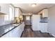 Eat-in kitchen equipped with white cabinets, ample counter space, and modern appliances at 3013 Avery St, Raleigh, NC 27610