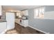 Bright kitchen featuring white cabinets, neutral walls, and modern appliances at 3013 Avery St, Raleigh, NC 27610
