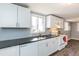 Updated kitchen with white cabinets, stainless steel appliances, and dark countertops offers a sleek design at 3013 Avery St, Raleigh, NC 27610