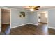 Spacious living room with wood-look floors and view into the kitchen at 3013 Avery St, Raleigh, NC 27610