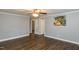 Living room showcasing beautiful flooring, a ceiling fan and fresh neutral wall colors at 3013 Avery St, Raleigh, NC 27610
