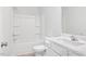 Bathroom featuring a sink vanity and a bathtub with white wall tile and white wall paint at 324 Longleaf Glen Court, Zebulon, NC 27597