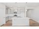 Spacious kitchen with gray cabinets, stainless steel appliances, and a center island with breakfast bar at 324 Longleaf Glen Court, Zebulon, NC 27597