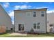 Back of house with patio and small yard at 3505 Triad Ct, Raleigh, NC 27604