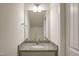 Stylish bathroom featuring granite countertops, a large mirror, and modern fixtures at 3505 Triad Ct, Raleigh, NC 27604