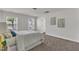 Well-lit bedroom with carpet, featuring two windows and tasteful decor at 3505 Triad Ct, Raleigh, NC 27604
