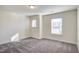 Bright bedroom with neutral gray carpet and two large windows at 3505 Triad Ct, Raleigh, NC 27604