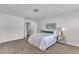 Bright bedroom with neutral carpet, white walls, and ample natural light at 3505 Triad Ct, Raleigh, NC 27604