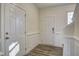 Bright foyer with hardwood floors, wainscotting, and classic trim at 3505 Triad Ct, Raleigh, NC 27604
