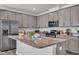 Modern kitchen featuring stainless steel appliances and granite countertops at 3505 Triad Ct, Raleigh, NC 27604