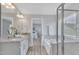 Elegant bathroom showcasing a double sink vanity, soaking tub, and walk-in shower at 3505 Triad Ct, Raleigh, NC 27604