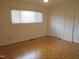 Empty bedroom with hardwood floors and natural light at 3738 Jamestown Cir, Raleigh, NC 27609