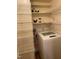 Functional laundry area with shelving and modern washing machine at 3738 Jamestown Cir, Raleigh, NC 27609