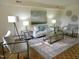 Bright living room with neutral furniture and hardwood floors at 3738 Jamestown Cir, Raleigh, NC 27609