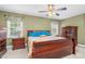 Charming bedroom featuring a sleigh bed, ceiling fan and natural light at 402 Hearthstone Dr, Nashville, NC 27856