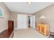 Bright bedroom featuring a large closet, neutral walls, and wood furnishings at 402 Hearthstone Dr, Nashville, NC 27856