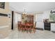 Dining room with a wooden table, china cabinet, tile flooring and natural light at 402 Hearthstone Dr, Nashville, NC 27856