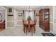 Bright dining room featuring a wooden table, china cabinet, and neutral decor at 402 Hearthstone Dr, Nashville, NC 27856
