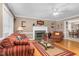 Inviting living room with a fireplace, hardwood floors, and comfortable seating area at 402 Hearthstone Dr, Nashville, NC 27856