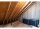 Unfinished attic space with exposed rafters and insulation at 4211 Norman Ridge Ln, Raleigh, NC 27613