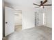 Bright bedroom featuring a ceiling fan, plush carpet, and access to a walk-in closet at 4211 Norman Ridge Ln, Raleigh, NC 27613
