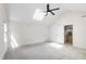 Large bonus room featuring vaulted ceilings, a fan, and abundant natural light at 4211 Norman Ridge Ln, Raleigh, NC 27613