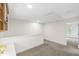 Spacious bonus room with a neutral color palette, plush carpet, and ample natural light at 4211 Norman Ridge Ln, Raleigh, NC 27613