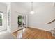 Dining room with hardwood floors, sliding doors to balcony and ample natural light at 4211 Norman Ridge Ln, Raleigh, NC 27613