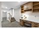 Comfortable home office featuring custom built-ins, carpet flooring, and ample storage at 4211 Norman Ridge Ln, Raleigh, NC 27613