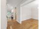 Open living room with hardwood floors, light-colored walls, and modern fixtures at 4211 Norman Ridge Ln, Raleigh, NC 27613