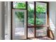 Enclosed sunroom featuring a wooden floor and screens, offering outdoor views at 4211 Norman Ridge Ln, Raleigh, NC 27613