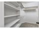 Organized walk-in closet featuring built-in shelving and ample storage space at 4211 Norman Ridge Ln, Raleigh, NC 27613