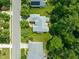 Aerial view of a home with a gray roof, surrounded by lush landscaping at 4613 Moores Creek Rd, Durham, NC 27705