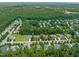 Wide aerial view of residential area with tree-lined streets and diverse home styles at 4613 Moores Creek Rd, Durham, NC 27705
