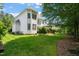 Expansive backyard features a well-maintained lawn and mature trees, creating a private retreat at 4613 Moores Creek Rd, Durham, NC 27705