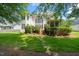 An inviting backyard with a lush lawn, mature landscaping, and a spacious deck at 4613 Moores Creek Rd, Durham, NC 27705