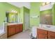 The ensuite bathroom features dual vanities at 4613 Moores Creek Rd, Durham, NC 27705