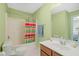 This bathroom is equipped with a shower-tub combo and single sink vanity at 4613 Moores Creek Rd, Durham, NC 27705
