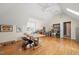 Spacious bonus room with hardwood floors, skylights, and room for activities at 4613 Moores Creek Rd, Durham, NC 27705