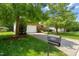 Charming brick home with a two-car garage, driveway, and a beautifully manicured front lawn at 4613 Moores Creek Rd, Durham, NC 27705