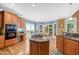 This kitchen features hardwood floors, wood cabinets, a center island, and a sunny breakfast nook at 4613 Moores Creek Rd, Durham, NC 27705